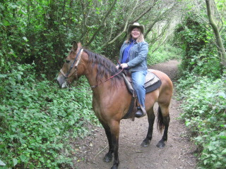 Nancy and Thelma on a horseback riding vacation in the forest of Half Moon Bay, California