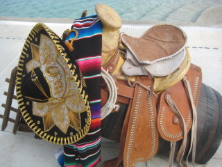 Mexican vaqueros prepare for a horseback riding vacation in Los Cabos
