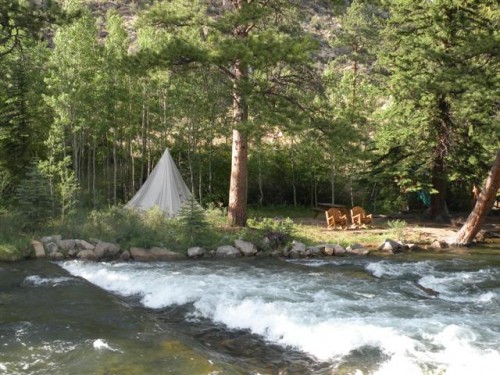 Ponderosa pines flank the North Fork of the Platte River on this Colorado horseback riding vacation