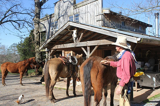 Larry Butler prepares for a horseback riding vacation at Seventy-Four Ranch
