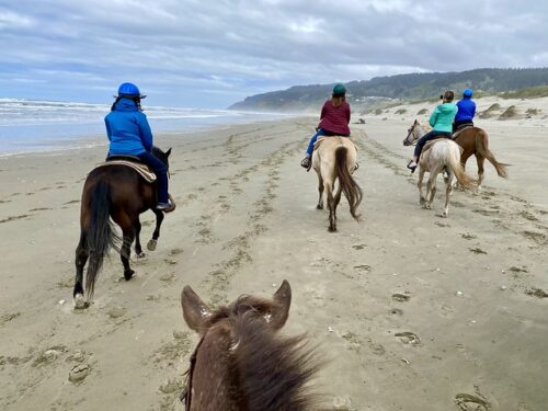 Horseback riding on the beach in Florence, Oregon